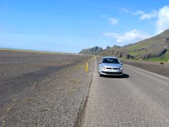 That's the runway off to the left marked with more red cones... just a smoothed spot in all that lava!
