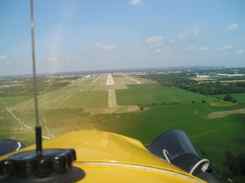 Cub on final approach to Oshkosh Cub on final approach to Oshkosh