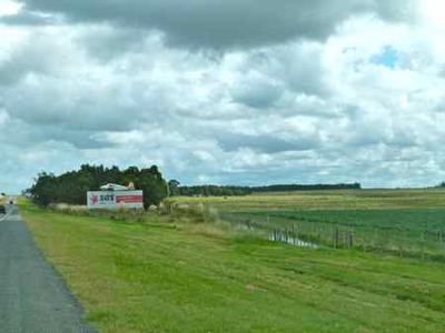 Is that a plane flying low over the road up ahead?