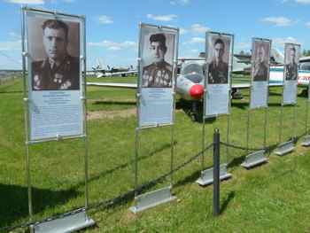 Photos of Soviet pilots line the walkway at the entrance to the outdoor exhibit at Monino.